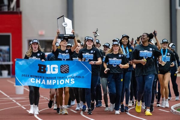 The women's track and field team celebrates a conference championship at last year's Big Ten Indoors.