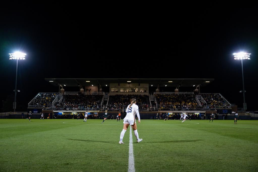 Sarah Bridenstine watches a play develop against Michigan State, backed by a sold-out crowd. 