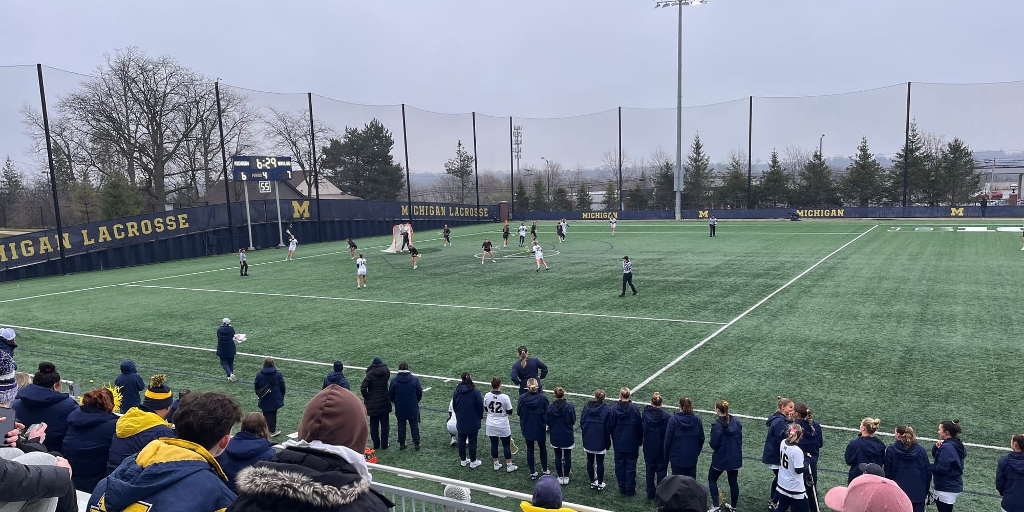 Kaylee Dyer attempts a pass as Michigan tries to lodge a 4th quarter comeback.